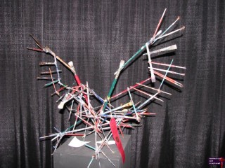 I found this in the art building.  It appears to be a bird made out of paint brushes.  Strange.